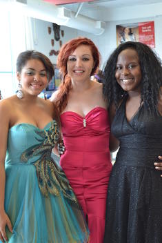 three female students in dresses